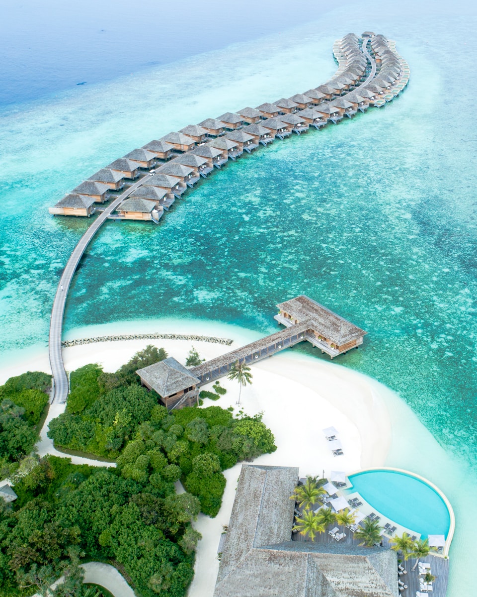 Photo by Shifaaz shamoon aerial view of island with houses at daytime